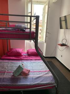 a bedroom with two bunk beds and a window at capitol in Marseille