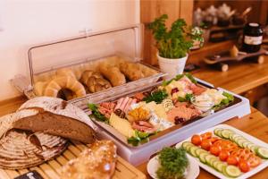 a tray of different types of food on a table at Almenlandhof in Fladnitz an der Teichalm +62 photos