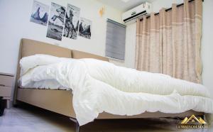 Llit o llits en una habitació de La MAISON SEONE BUSINESS