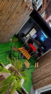 an overhead view of a patio with chairs and a television at Moonlight Etna B&B Catania in Catania