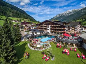 an aerial view of a hotel with a resort at Relais&Châteaux Spa-Hotel Jagdhof in Neustift im Stubaital