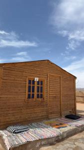 a wooden building with a window on the side of it at Anne Nuweiba in Nuweiba +9 photos