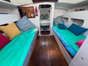 two beds in the back of an rv at Voilier Bateau Rochefort in Rochefort