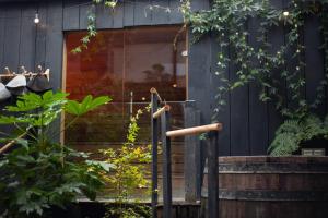 a entrance to a building with stairs and plants at Sauna Haus in Brighton & Hove