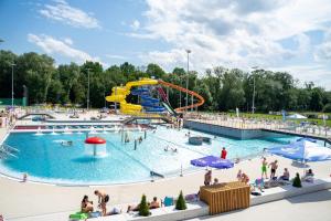 a group of people in a pool at a water park at Gael Stary Rynek 1 in Elblag