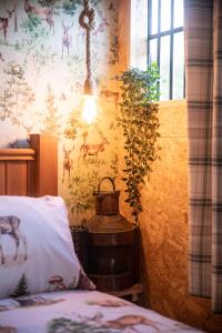 a bedroom with a giraffe wallpaper on the wall at Parrys Horse box in Exmouth