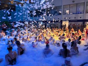 a large group of people sitting in foam clouds in a building at Gael Stary Rynek 1 in Elblag +61 photos