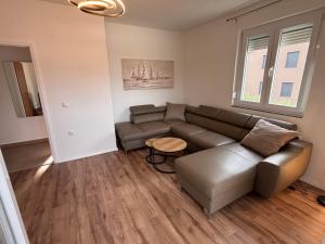 a living room with a couch and a table at Apartment Karmen in Šilo