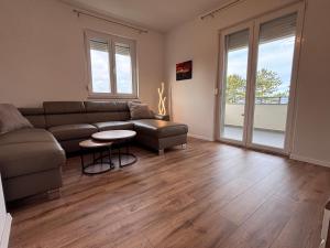 a living room with a couch and a table at Apartment Karmen in Šilo +16 photos