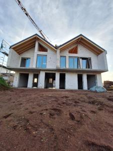 a house is being built on top of a field at Ferienhaus BERLUV in Berlingerode