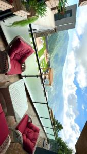 a view of the ocean from inside a building at Premium Murree Apartment With Stunning Views in Murree