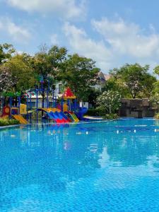 a large swimming pool with a colorful playground at LumiShora Villa - Bai Truong, Phu Quoc in Phú Quốc