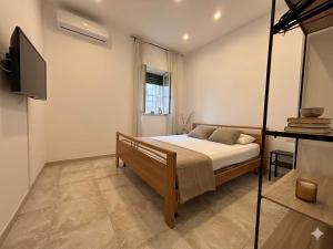 a bedroom with a bed and a television in it at De Sio Country Village in Peschici