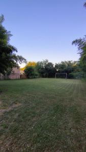 a field with a soccer goal in the middle at margarita in Sauce Viejo