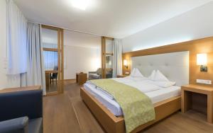 מיטה או מיטות בחדר ב-Vinschgerhof