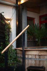 a pair of baseball bats on a railing in front of a house at Sauna flat Central Brighton in Brighton & Hove
