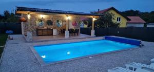 a swimming pool in the backyard of a house at Villa Oaza Vilenjak in Visoko