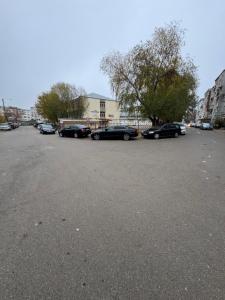 a parking lot with several cars parked in it at HomeStars16 in Bîrlad
