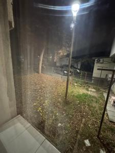 a street light in a yard at night at HomeStars16 in Bîrlad