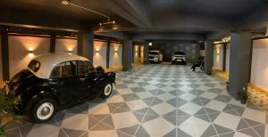 an old car is parked in a garage at Shanti Regency in Guwahati