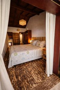 a bedroom with a large bed in a room at Varanda do Mar Caraíva Oceanfront in Porto Seguro