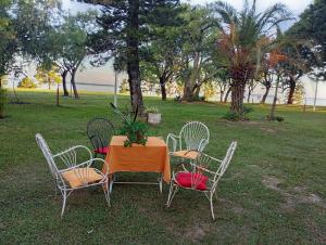 a table with four chairs and a plant on it at Finca Re Mar 1 in Santa Ana +17 photos