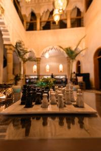 a chess game on a table in a building at Riad Golden in Rabat