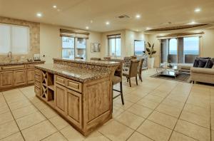 a large kitchen with a large island in a living room at Bella Sirena Resort Stellar View C601 in Puerto Peñasco