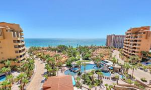 an aerial view of a resort with a pool and the ocean at Bella Sirena Resort Stellar View C601 in Puerto Peñasco +47 photos