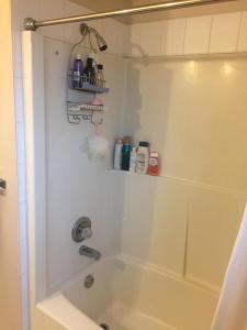 a bathroom with a tub and a shower with a sink at warm house2 in Coquitlam +17 photos