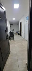 an empty room with an open door and a room with chairs at Apartament for 2 people - Jorge Two in Adrogue