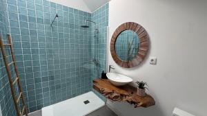a bathroom with a sink and a mirror at Quinta Maria Cotovia in Porto Covo +34 photos