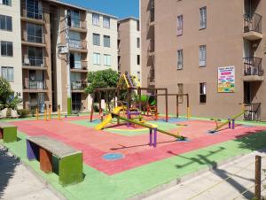 a playground in front of a apartment building at Deluxury in Santa Marta +7 photos