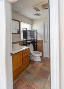 a bathroom with a toilet and a sink at GorgeousWestwood in Westwood +15 photos