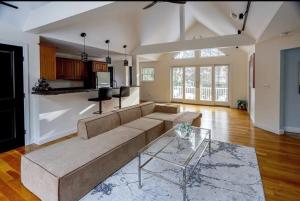a living room with a couch and a table at GorgeousWestwood in Westwood