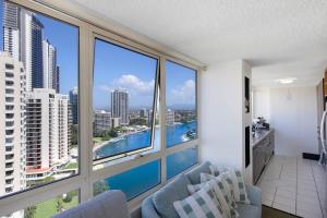 a living room with a view of a large window at Salt & Sky Arcade - Sleeps 12 in Gold Coast