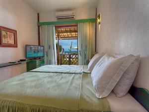 Postel nebo postele na pokoji v ubytování Bruno Marambaia Charme Hotel