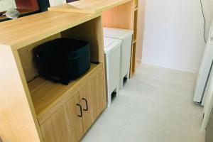a room with a desk with a black bag in it at あざみ庵 奄美大島 in Amami +11 photos
