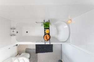 a small bathroom with a sink and a toilet at 3-Bedrm, Parking, Soccer Table, Sleeps 7 in Cannock +39 photos