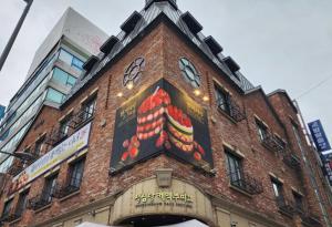 a brick building with a clock on top of it at Coco House in Daejeon