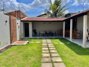 a backyard with a table and a house at Casa completa em Bragança in Bragança