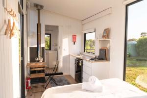 a small kitchen with a sink and a counter at The Nest at Arahura Escape by Tiny Away in Kaihinu