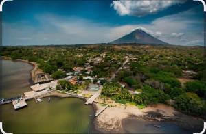 an aerial view of a island with a mountain in the background at Casa Caimana in Moyogalpa