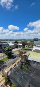 an aerial view of a city with a street at Flats Paris in Lagoa Santa