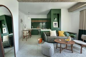 a living room with a couch and a table at basePLUS-Shanghai Binjiang Serviced Apartment in Shanghai