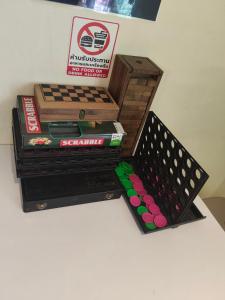 a table with a wooden box and books on it at JAM's HOSTEL in Ko Phangan