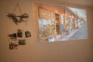 a wall with a picture of a street on it at Shalom Gold Terrace in Paju