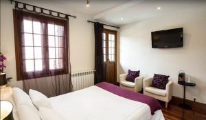 Katil atau katil-katil dalam bilik di Hotel Itxas Gain Getaria
