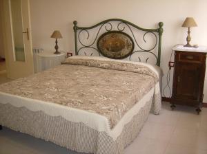 Postel nebo postele na pokoji v ubytování Agriturismo Borgo Vigna Vecchia