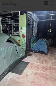 two tents in a room with a wall at La casa de ito la chorrera in La Chorrera +2 photos